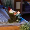Solar Red Bird Rocking Chair Gnome - Outdoor Garden Decor with Solar Panel for Energy Efficiency